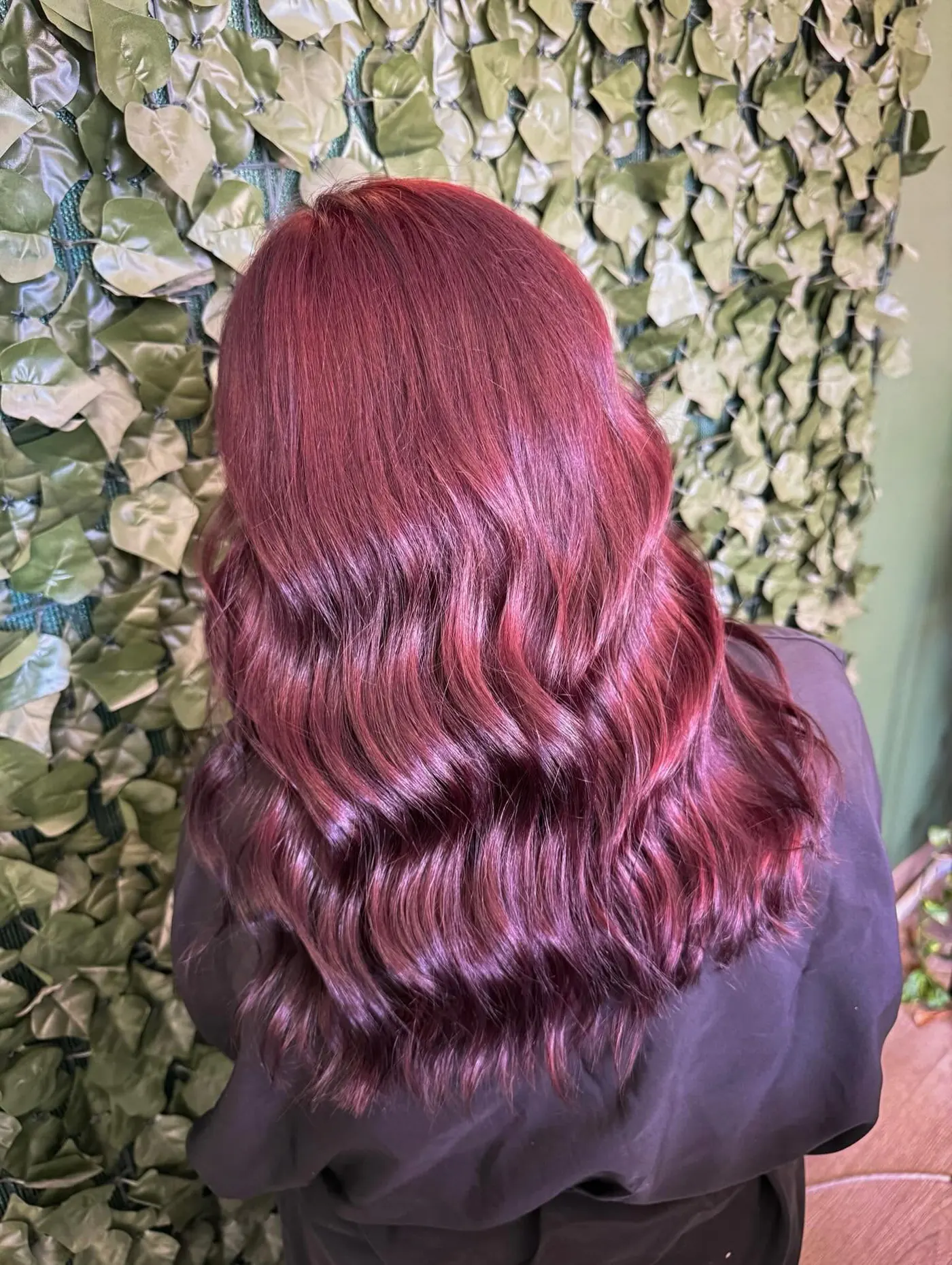 A vivid raspberry red worn in polished waves — Cosmetology by Cami, Hammond, Louisiana